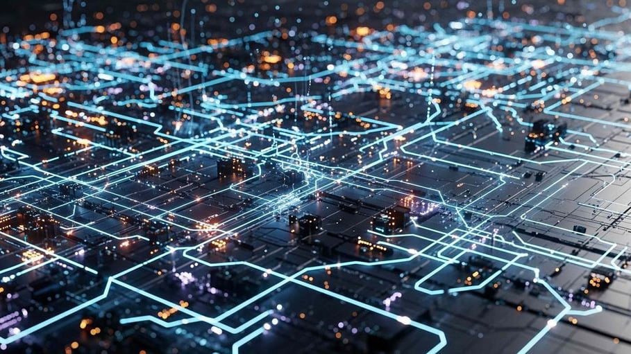 Abstract digital visualization of a dark motherboard grid with glowing blue network lines and illuminated connection nodes, representing a connected enterprise hybrid IT estate and digital thread.